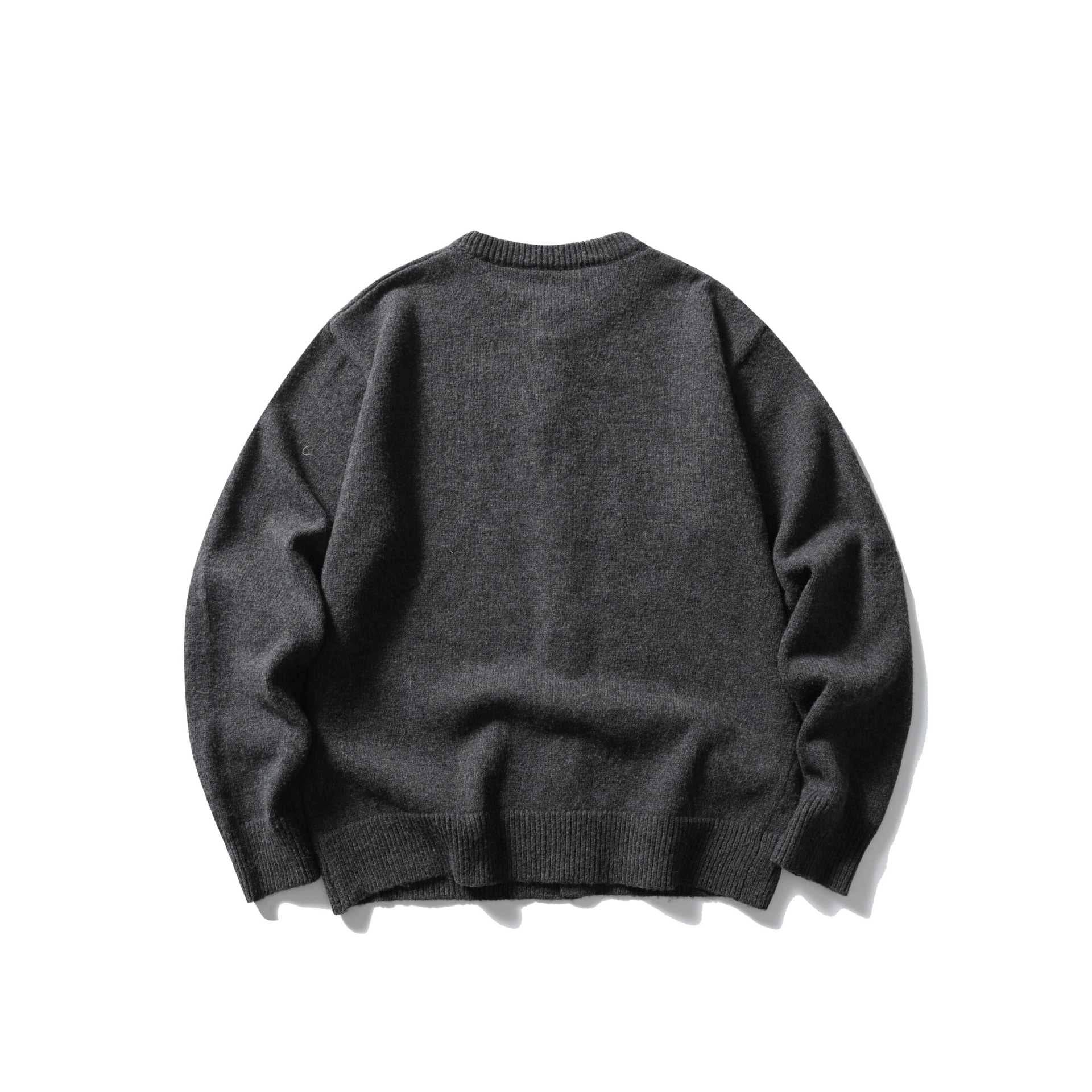 Women's fine knit cardigan with round neckline, full button placket and wide ribbed cuffs.