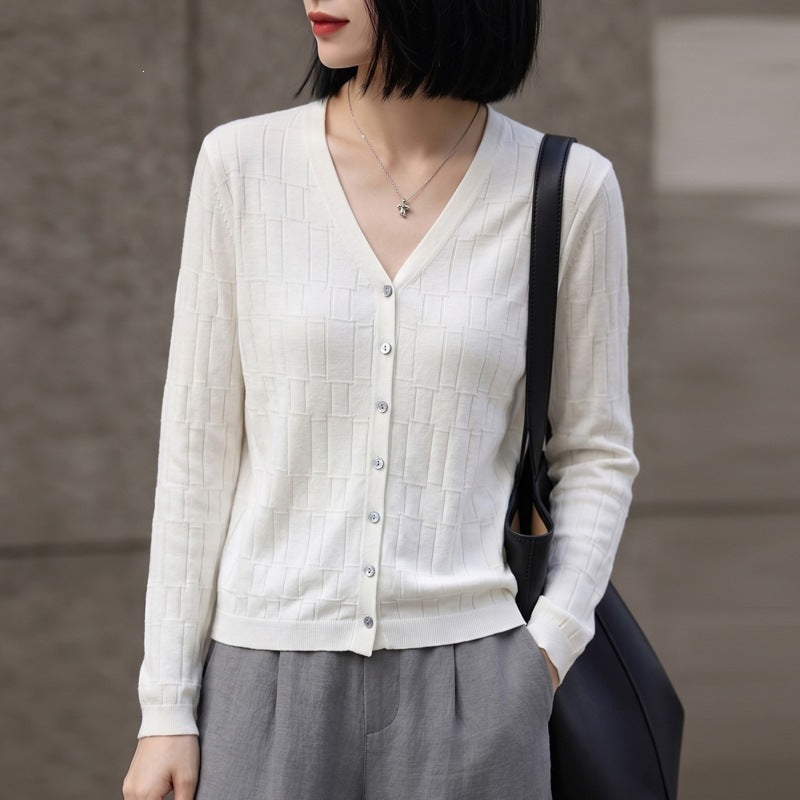 Ladies V-neck fine knit cardigan with structured block design and continuous button placket Chichicherry