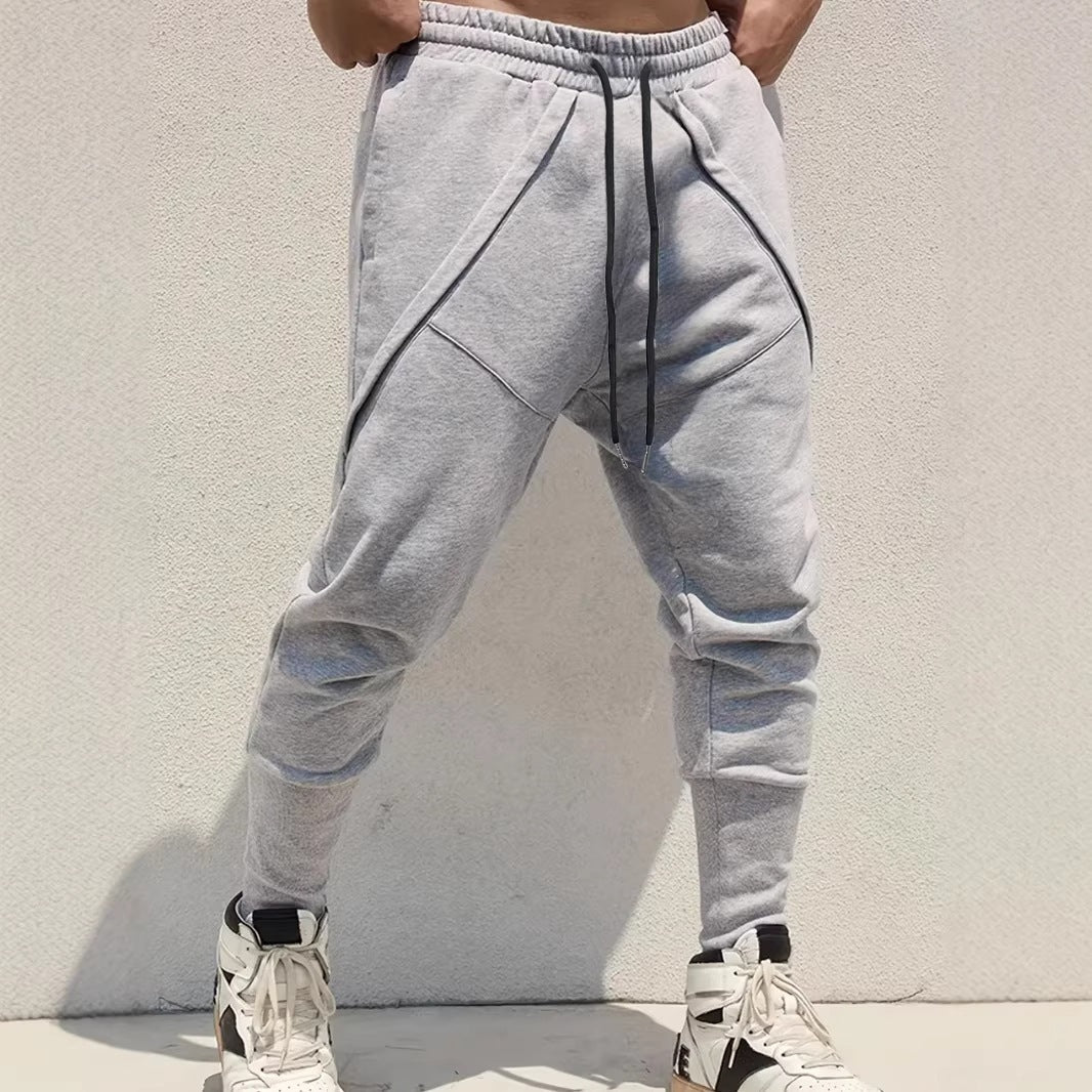 Men's Tapered Jogging Pants with Drop Crotch, Elastic Waistband & Diagonally Placed Pockets Chichicherry
