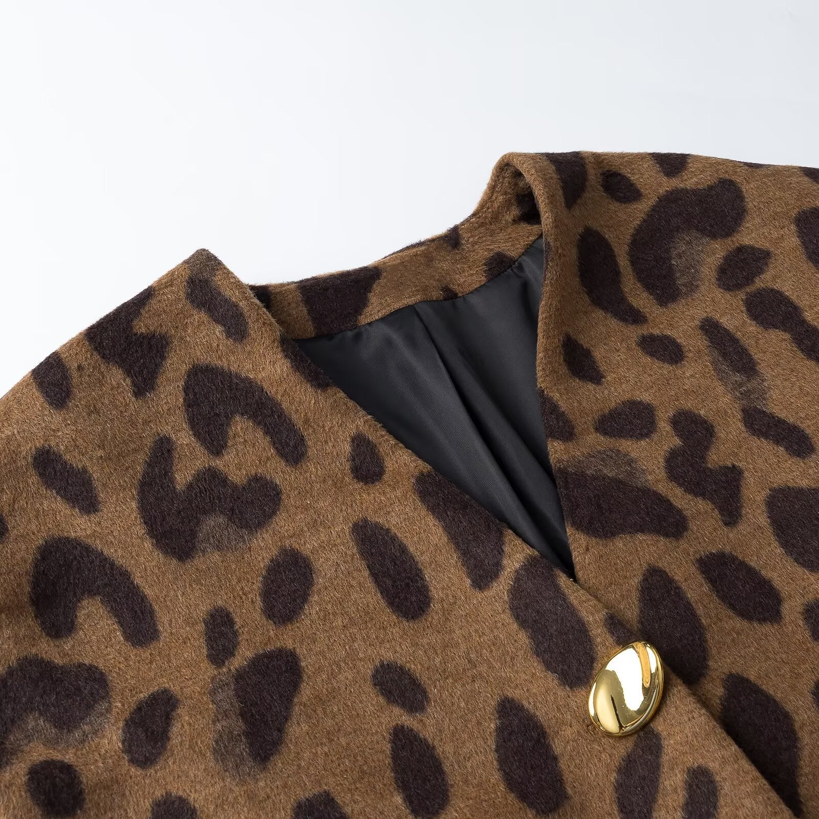 Ladies sleeveless wool blend vest in leopard print with V-neck and decorative button Chichicherry