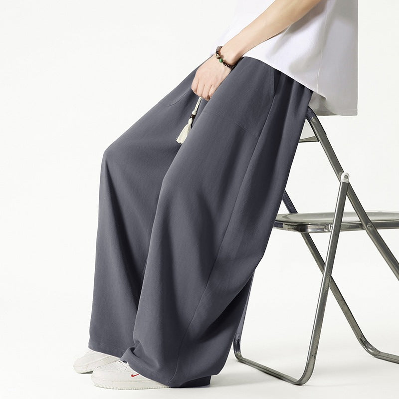 Men's loose-fitting lounge pants with tassel cord, elastic waistband, and patch pockets Chichicherry