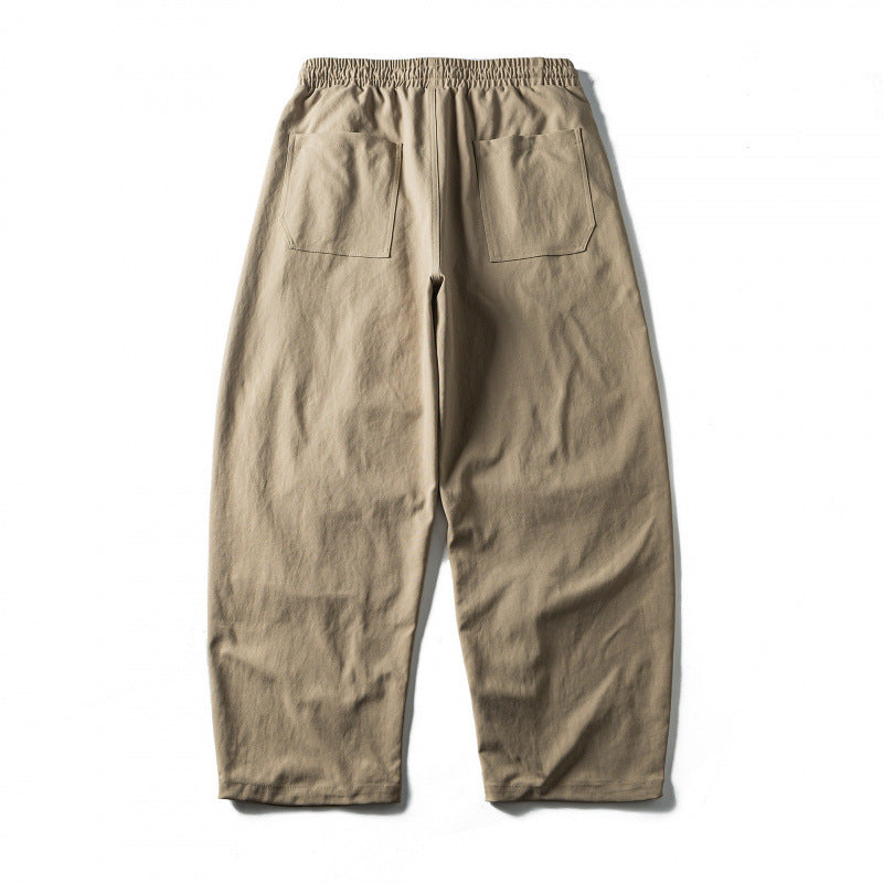 Unisex Wide Cropped Pants with Drawstring, Elastic Waistband and Distinctive Seam Panels Chichicherry