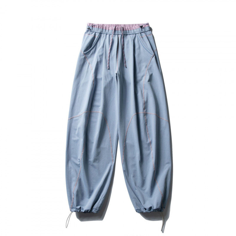 Unisex locker cut tech jogging pants with elastic waistband, distinctive flatlock seams and drawstring Chichicherry