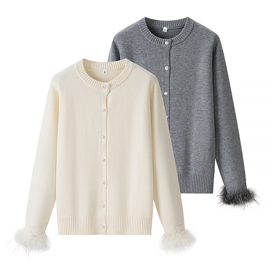 Women’s knit cardigan with pearl buttons and feather-trimmed sleeve cuffs Chichicherry