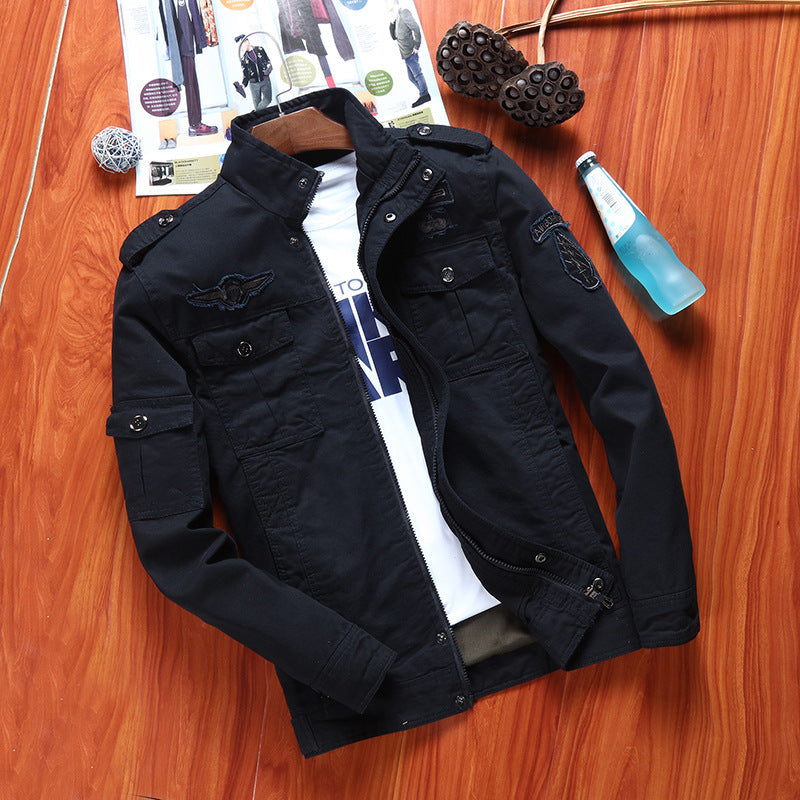 Men's canvas field jacket in military utility style with stand-up collar, shoulder patches, and multi-functional pockets Chichicherry