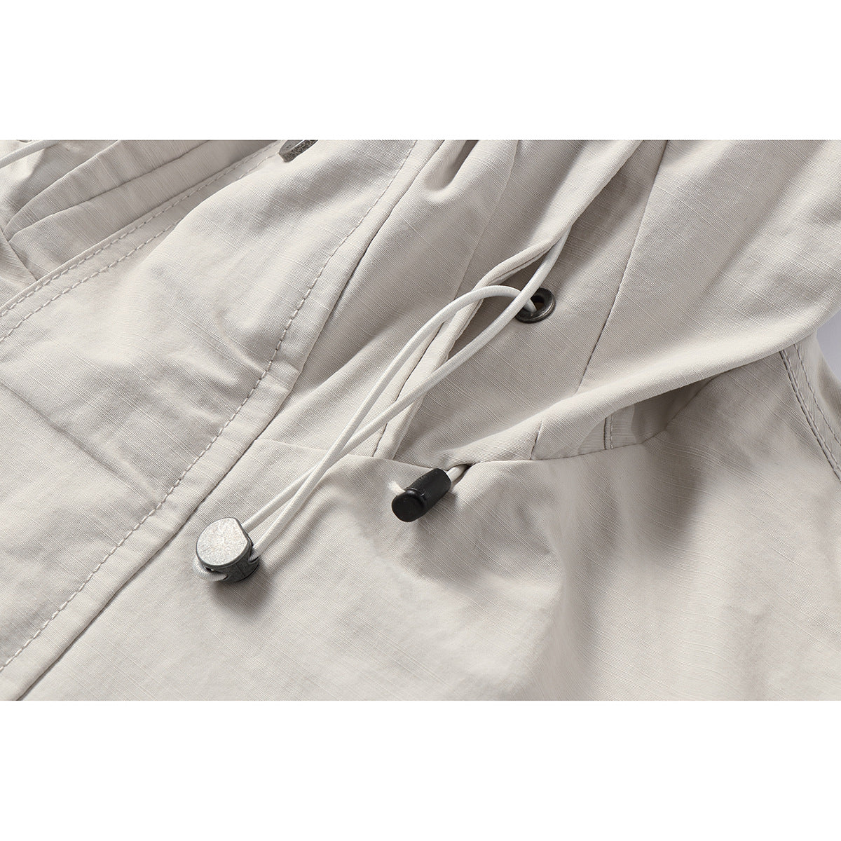 Unisex Light windproof hooded jacket in boxy cut with drawstring and concealed front Chichicherry