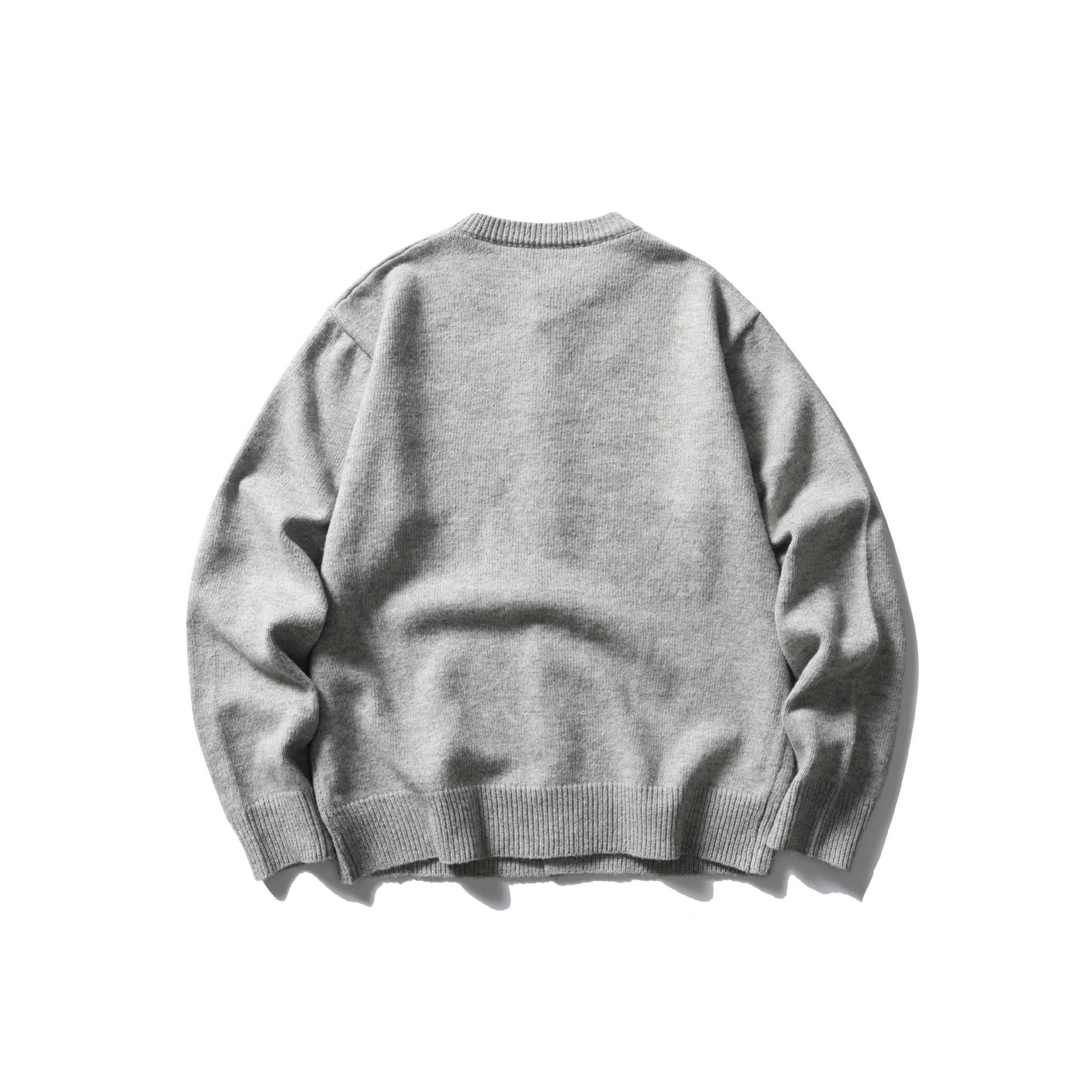 Women's fine knit cardigan with round neckline, full button placket and wide ribbed cuffs.