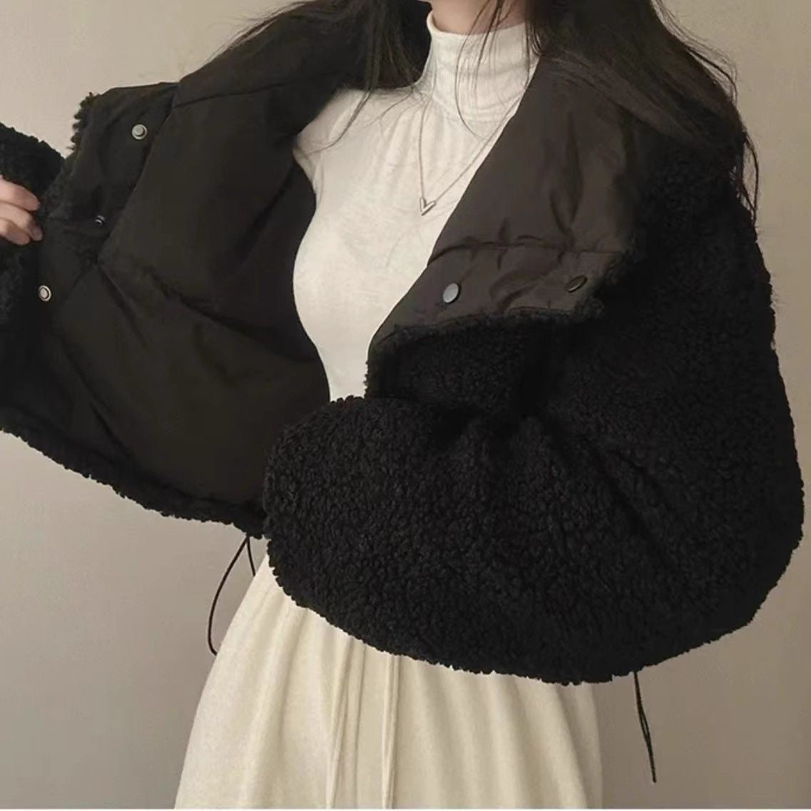 Women's short quilted puffer jacket with teddy collar, roll-up sleeves, and drawstring hem Chichicherry