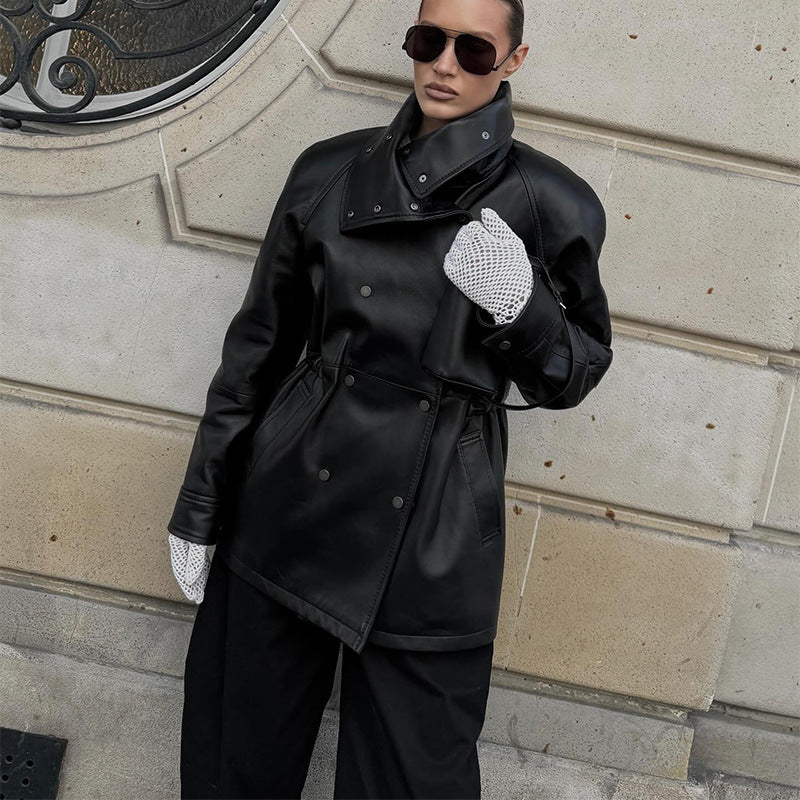Women's rain jacket made of leather look with high stand-up collar, waist drawstring and snap button front Chichicherry
