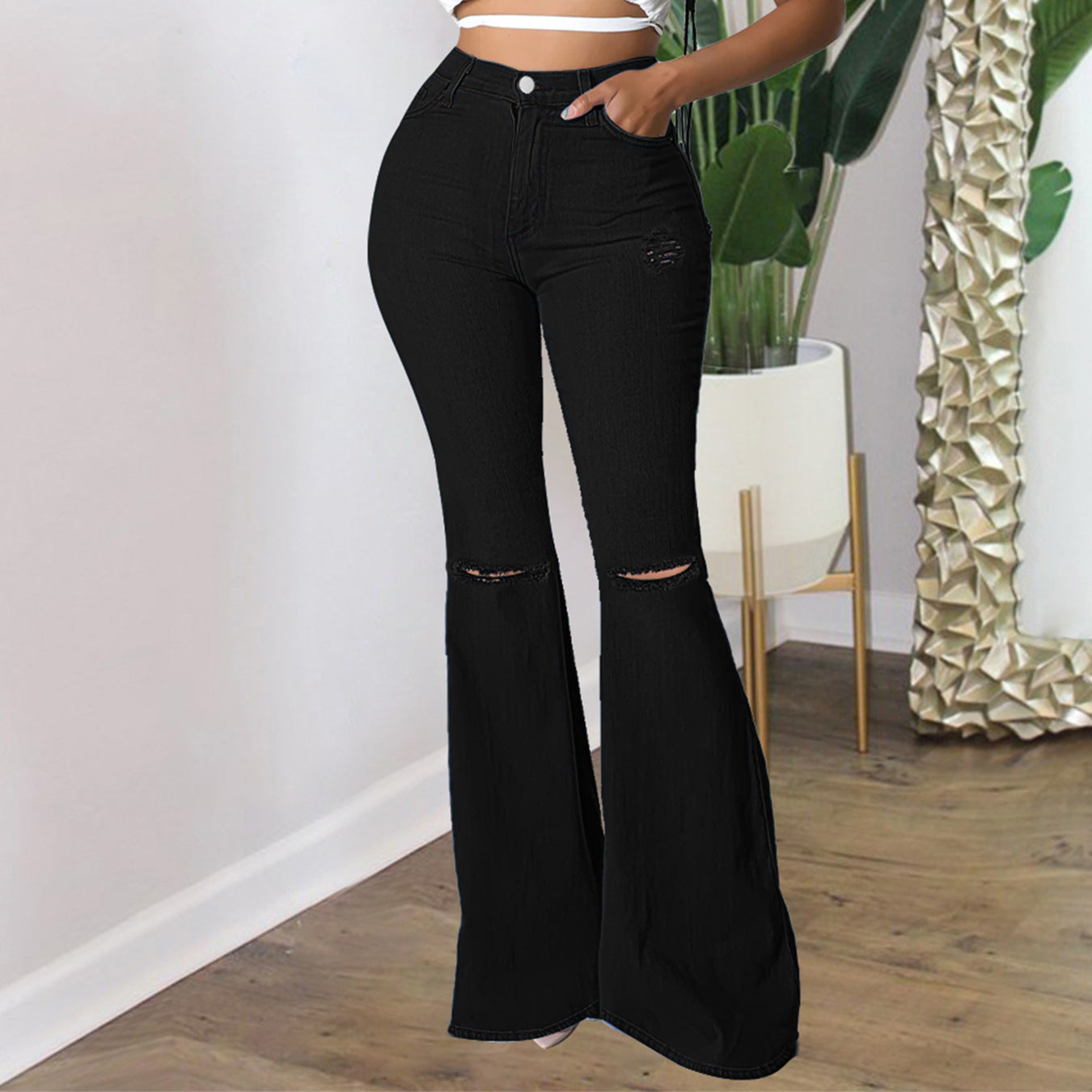 Women's high-waisted flared pants made of stretch denim with knee rips and shaping waistband Chichicherry