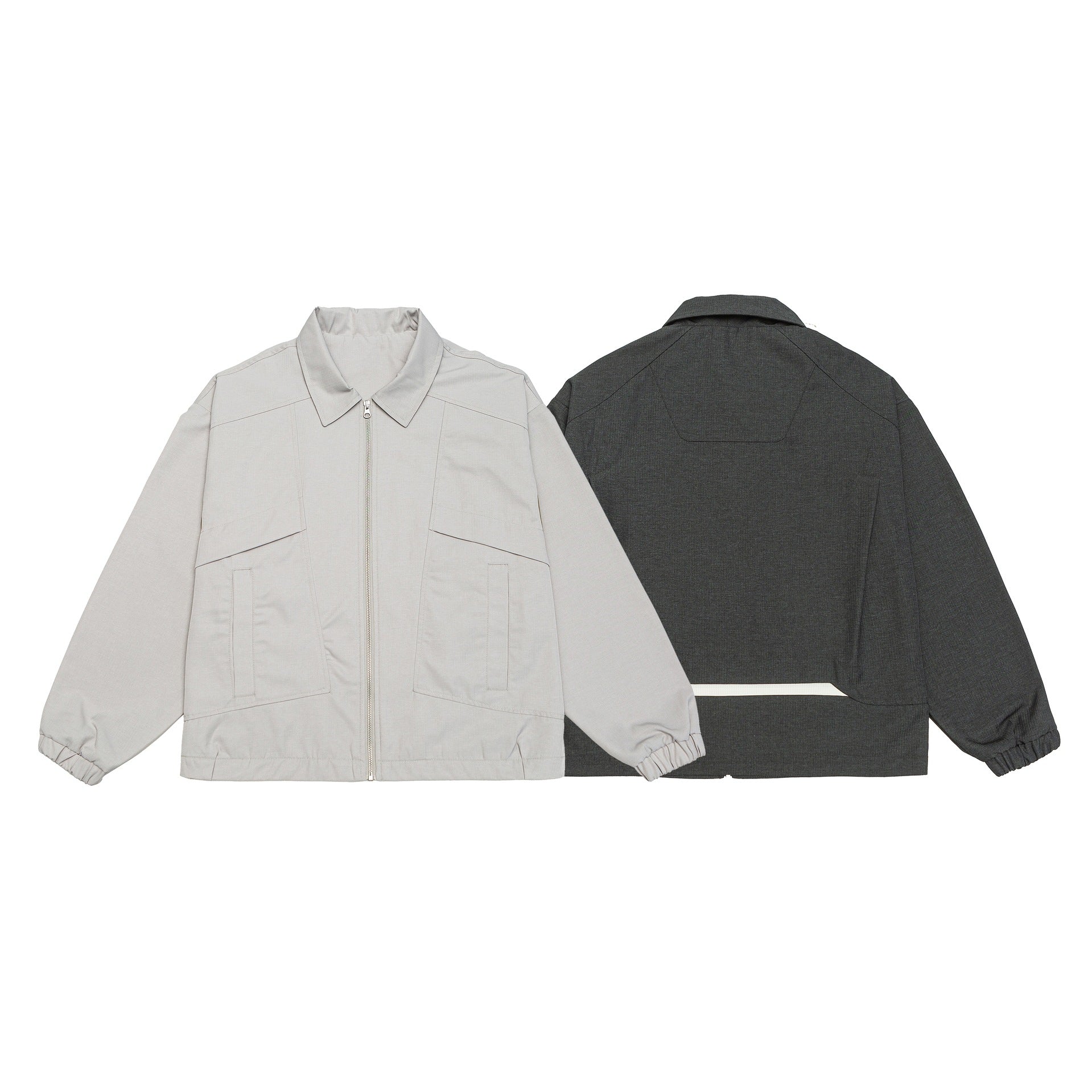 Unisex short jacket in boxy cut with shirt collar, visible metal zipper and utility patch pockets Chichicherry