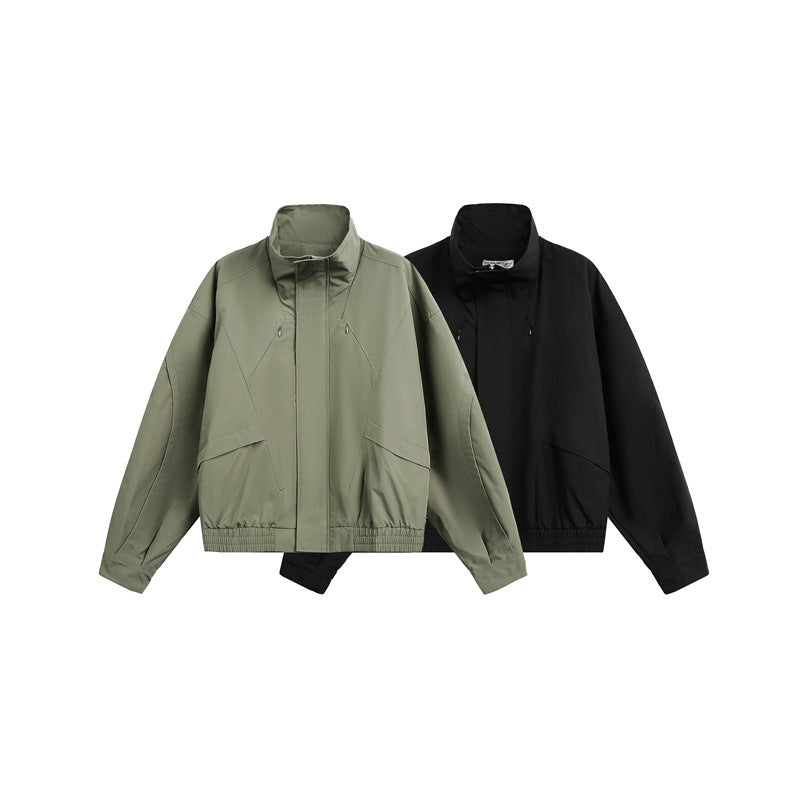 Unisex short jacket in minimalist tech fabric with funnel collar and concealed front placket Chichicherry
