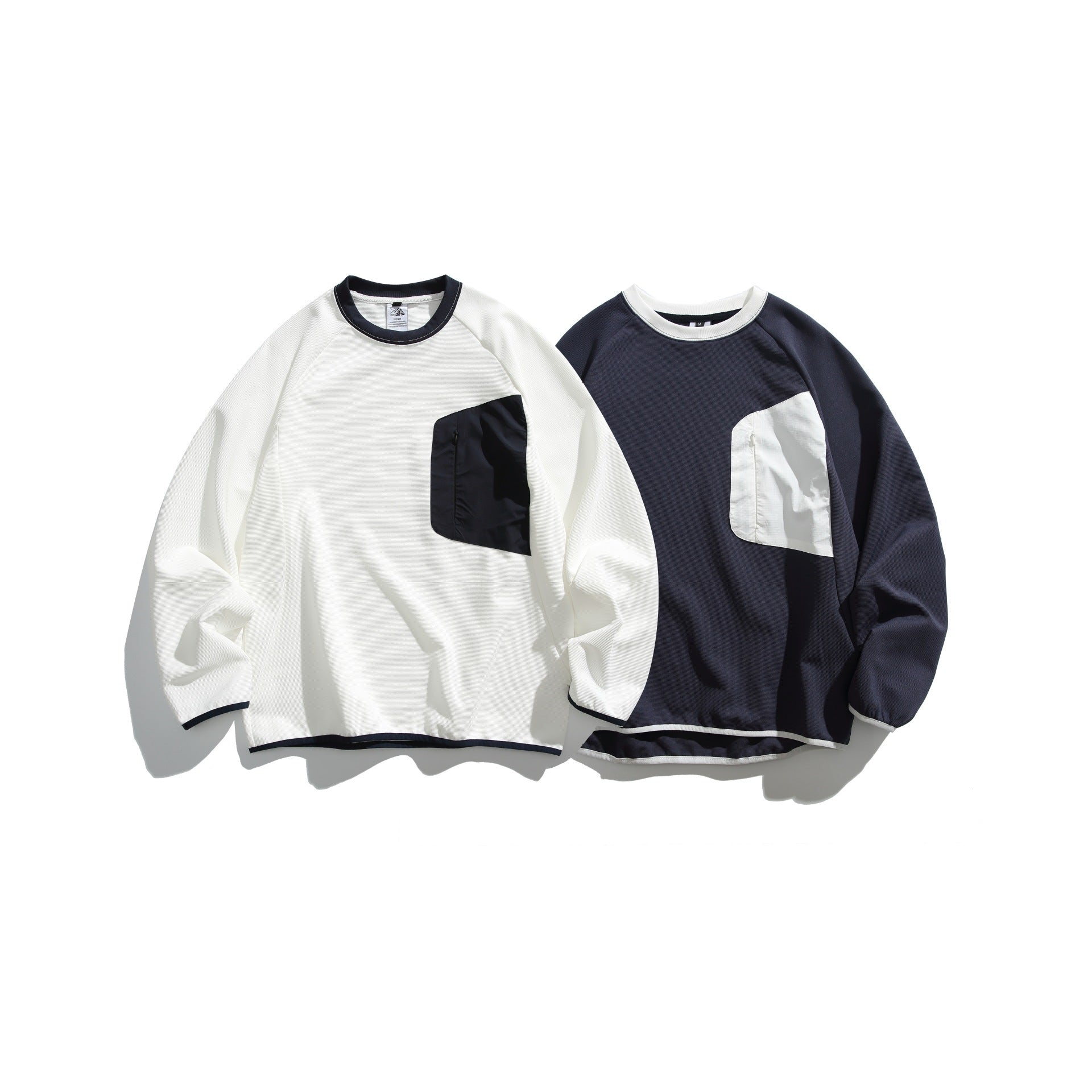 Unisex Boxy Sweatshirt with technical ribbed structure, applied zippered chest pocket and ribbed hem Chichicherry