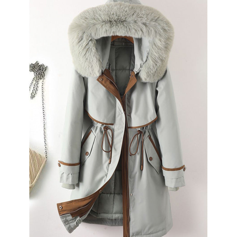 Women's long parka with faux fur hood, waist drawstring, and contrasting piping Chichicherry
