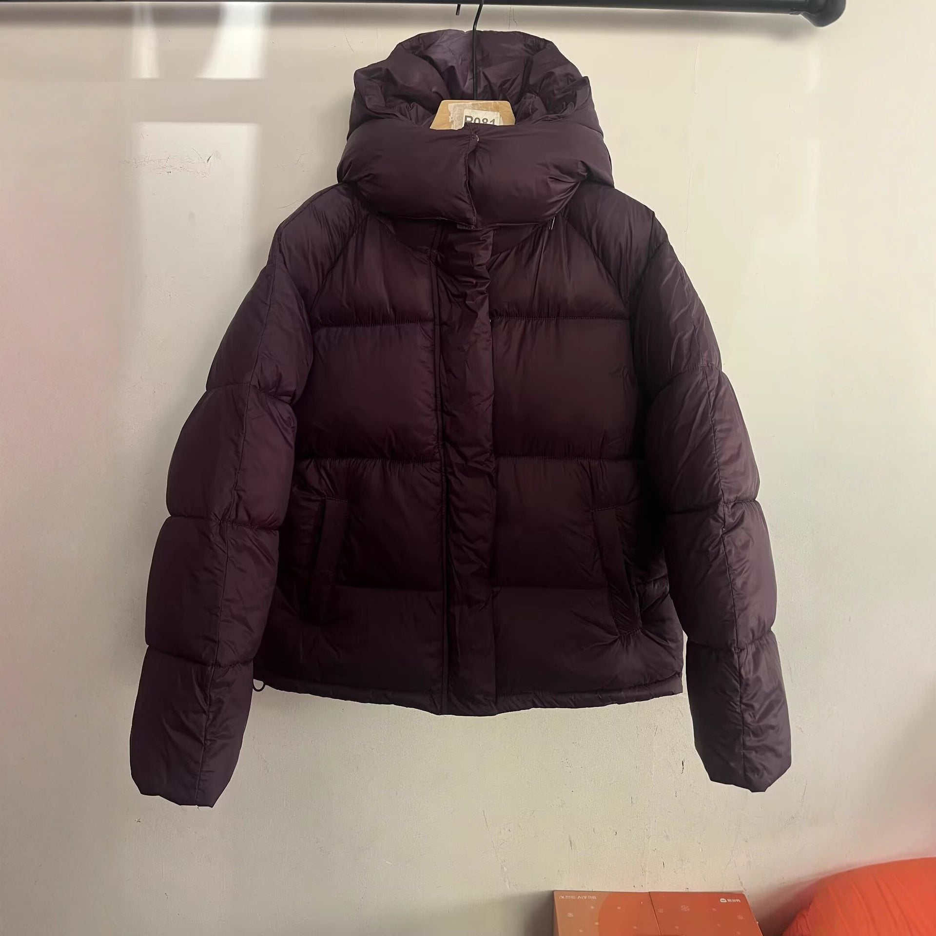 Women's short cut oversized quilted jacket with high collar and hood Chichicherry