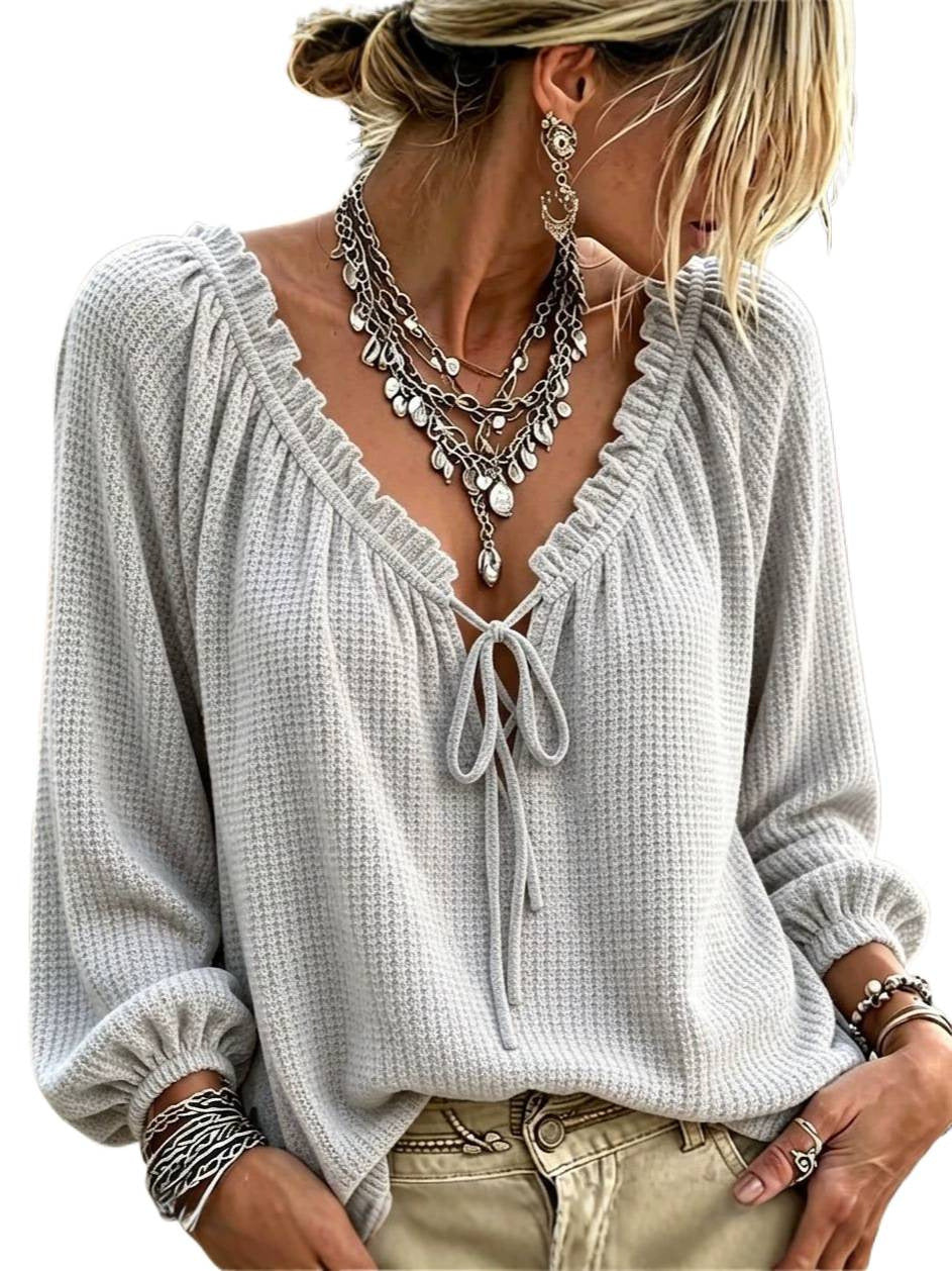 Women's waffle knit long sleeve with deep V-neck, ruffle trim and drawstring hood