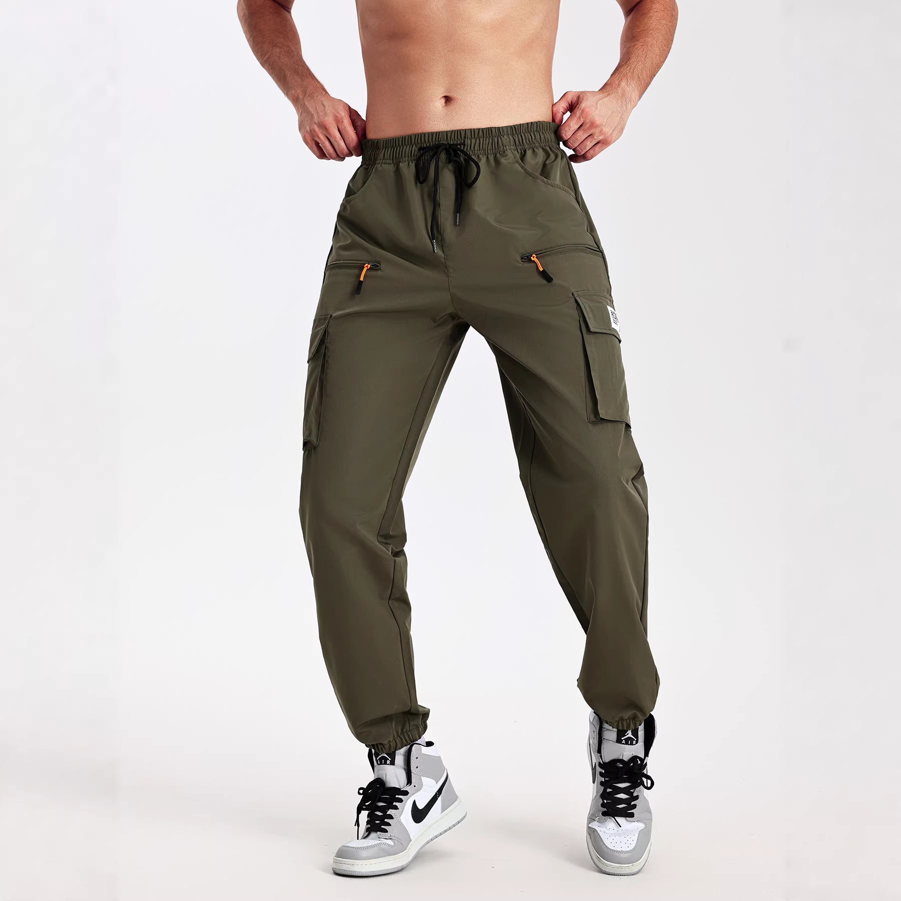 Men's tapered cut utility cargo pants in jogger style with drawstring waistband, zippered pockets & elastic leg cuffs Chichicherry