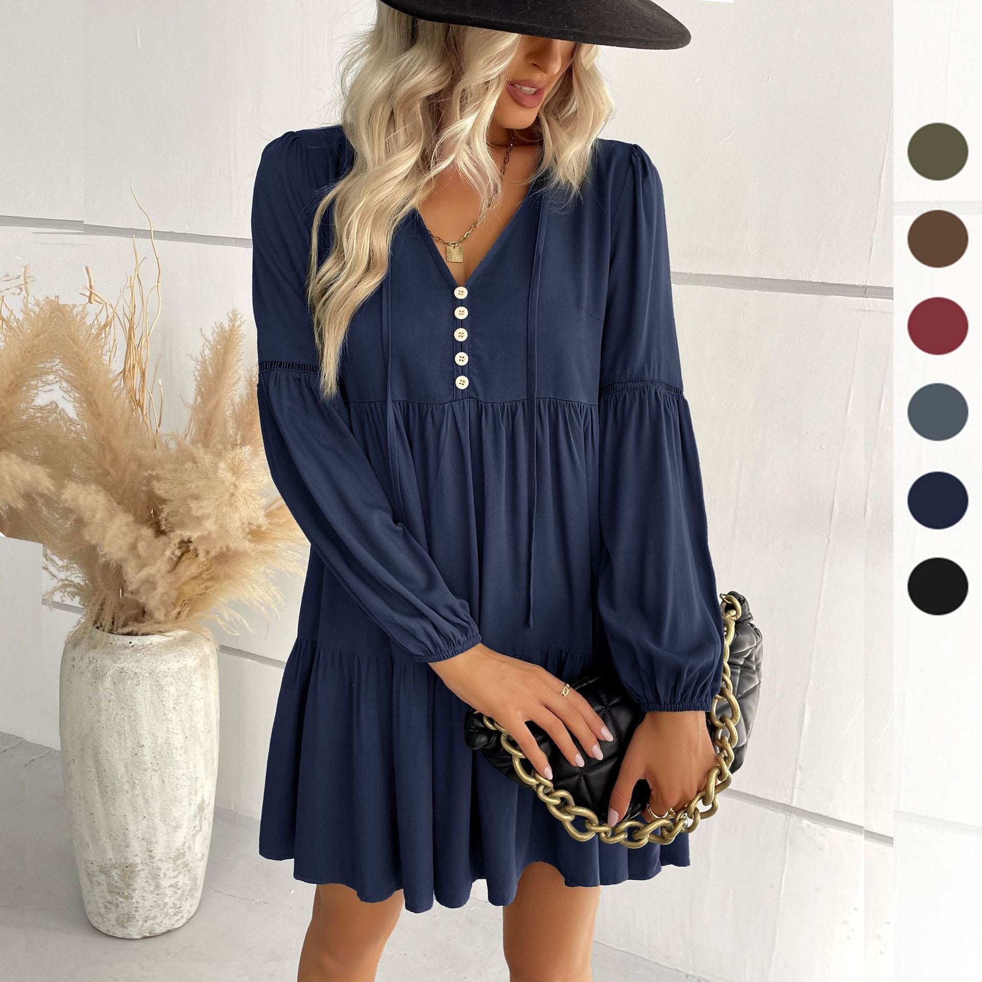 Ladies short-cut tiered babydoll dress with V-neck, button placket and balloon sleeves Chichicherry