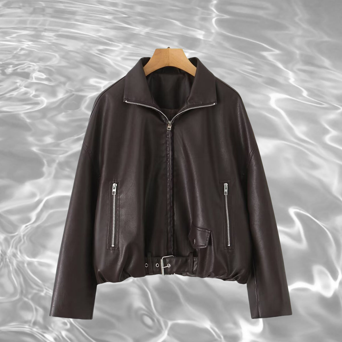 Women’s cropped oversized leather jacket in bomber style with zippered pockets and waist belt Chichicherry