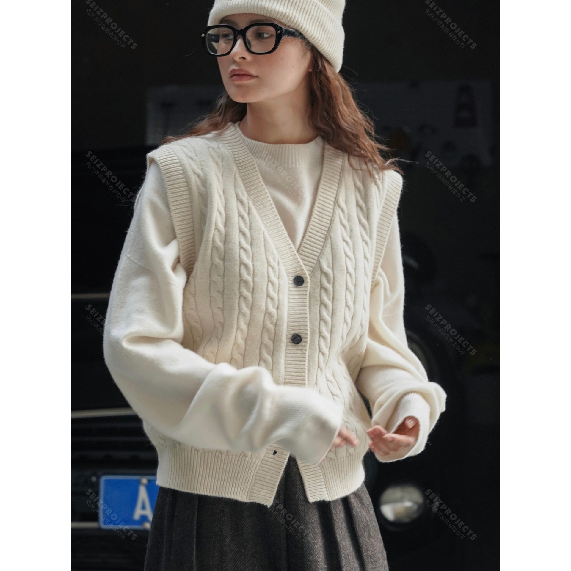 Women's chunky knit cable vest with deep V-neck and button placket Chichicherry