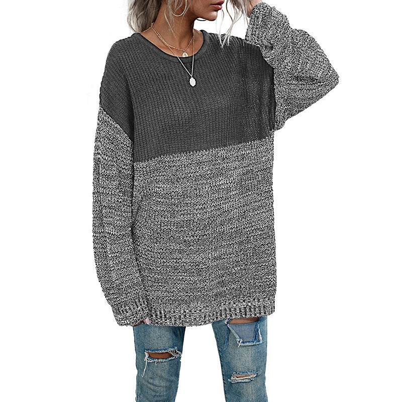 Women's oversized knitted sweater with color block look, round neckline, and mottled textured knit.