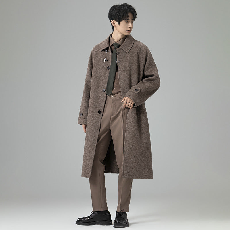 Men's floor-length wool blend coat in oversized cut with distinctive hook closures Chichicherry