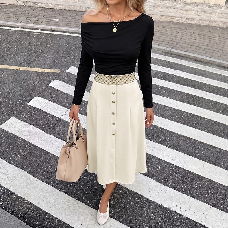 Women's midi skirt with high waist, decorative button placket and feminine A-line