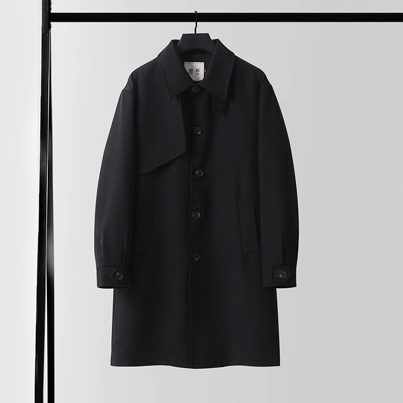 Men's modern minimalist trench coat with asymmetric shoulder flap and knee-length silhouette Chichicherry