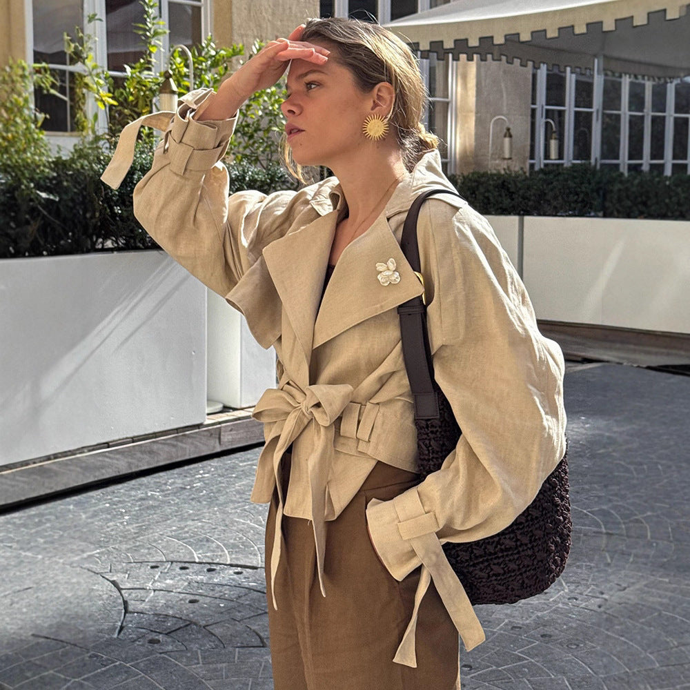 Women’s short trench coat with waist knot detail, cape sleeves, and boxy cropped cut Chichicherry