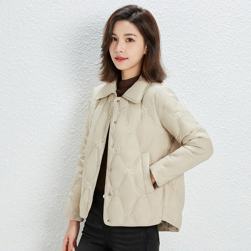 Women Short Cut Quilted Jacket with Decorative Stitching and Rounded Hem Chichicherry