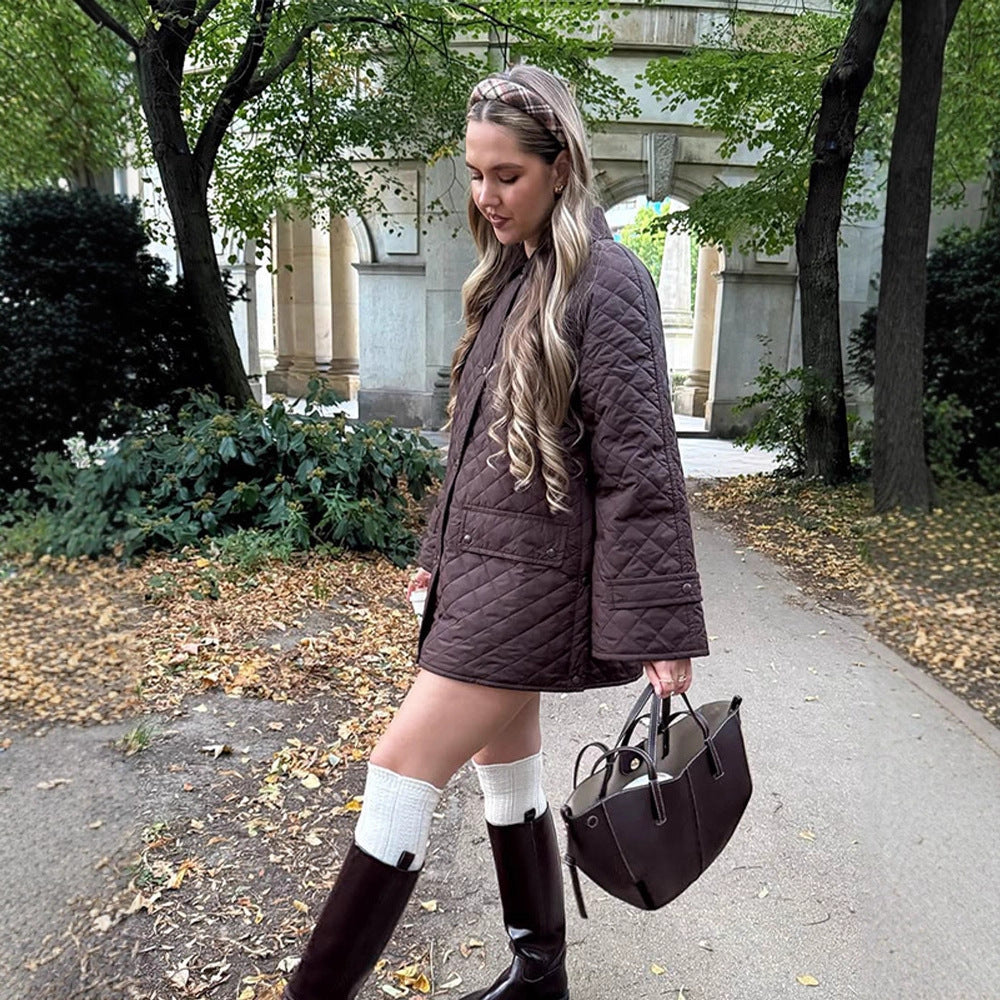 Women's oversized quilted jacket in coat style with snap button placket and patch flap pockets Chichicherry