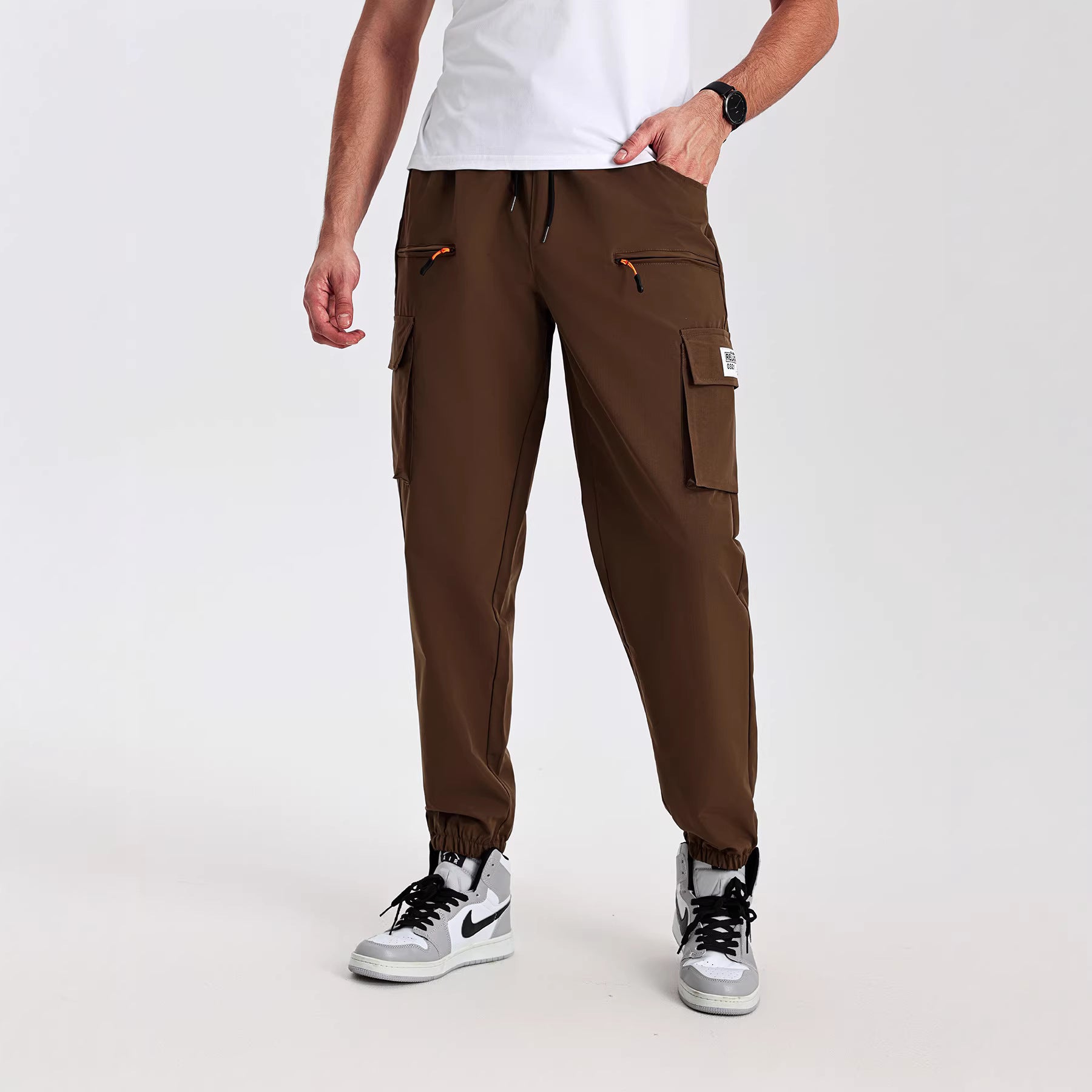 Men's tapered cut utility cargo pants in jogger style with drawstring waistband, zippered pockets & elastic leg cuffs Chichicherry