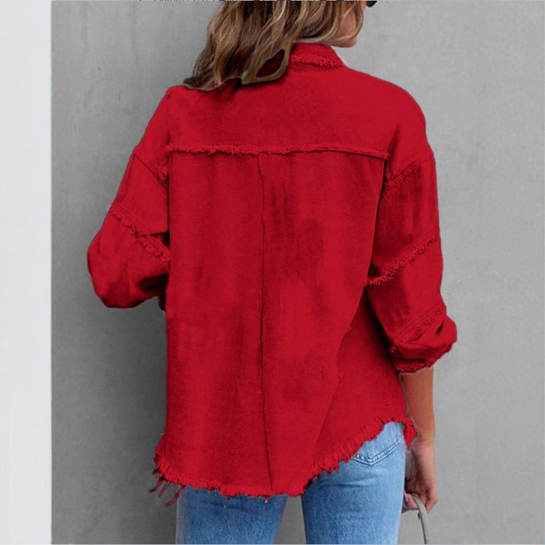 Women's oversized denim shirt jacket with fringe trim, flap pockets, and snap front Chichicherry