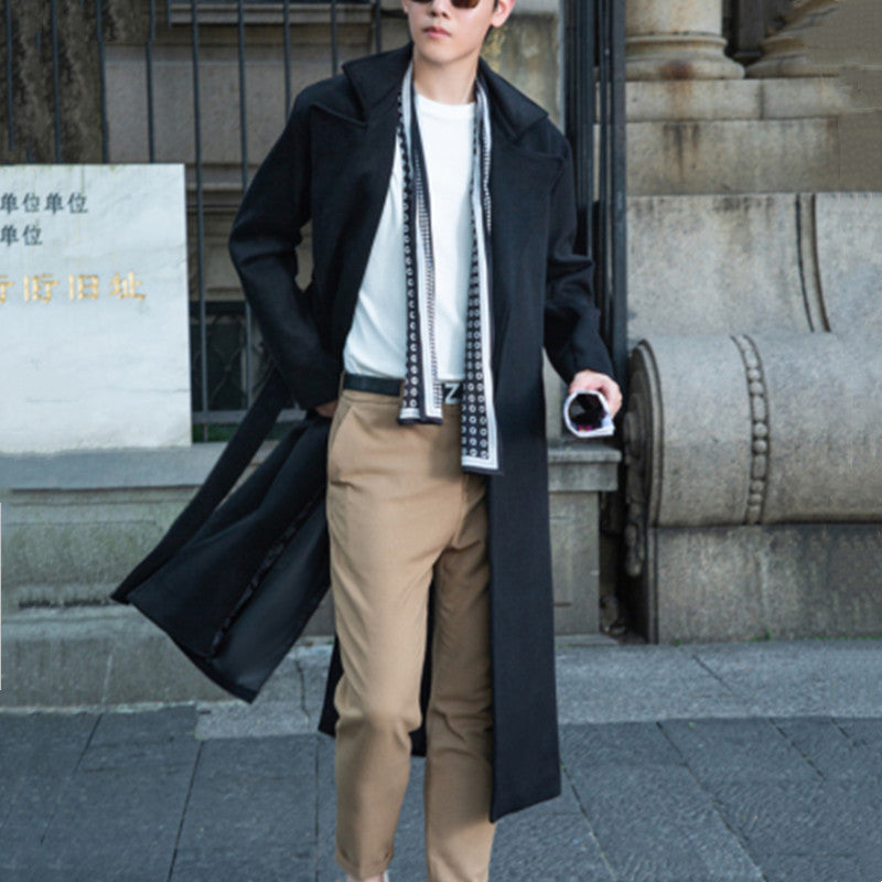 Men's long cut wool coat in minimalist design with generous shawl collar and concealed button placket Chichicherry