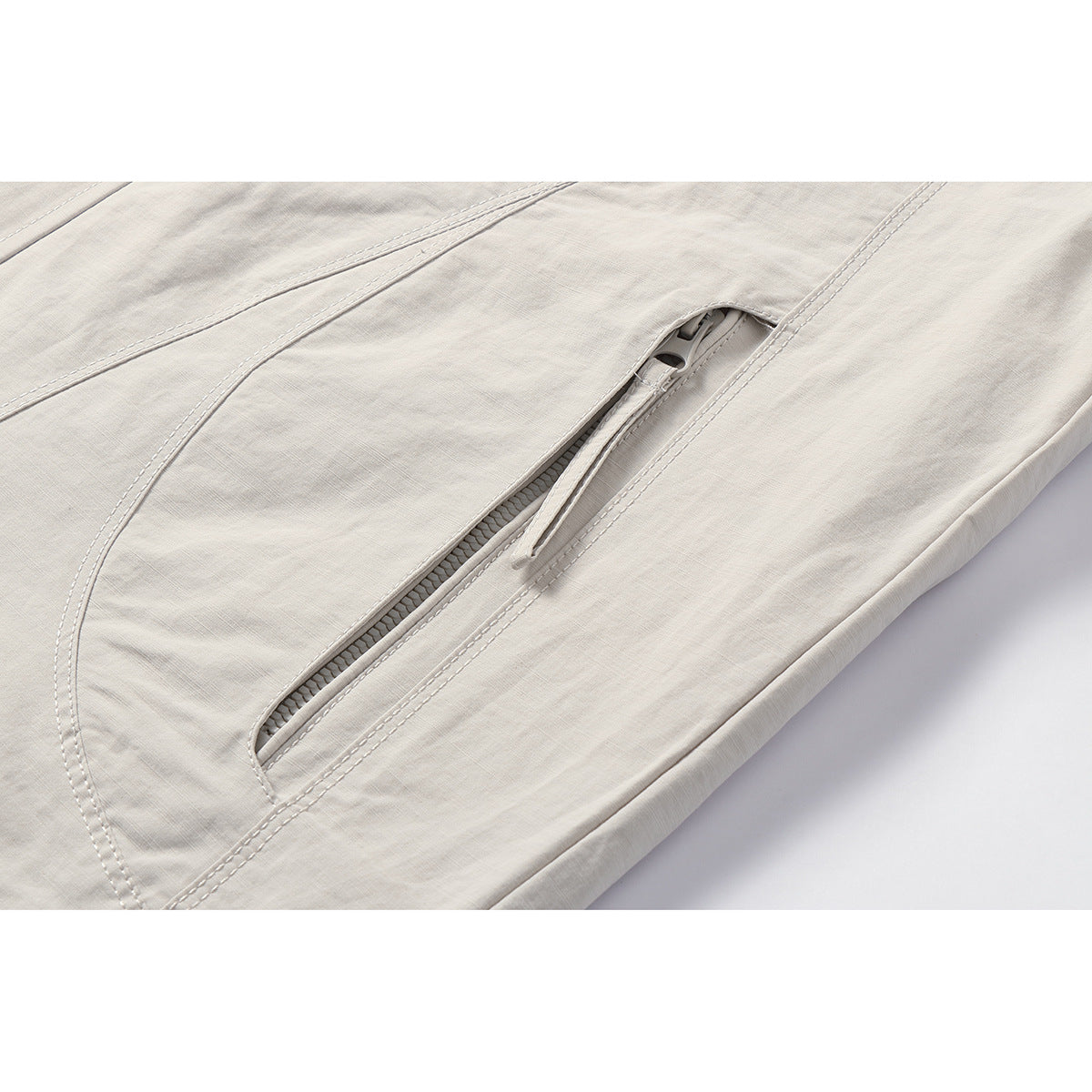 Unisex Light windproof hooded jacket in boxy cut with drawstring and concealed front Chichicherry