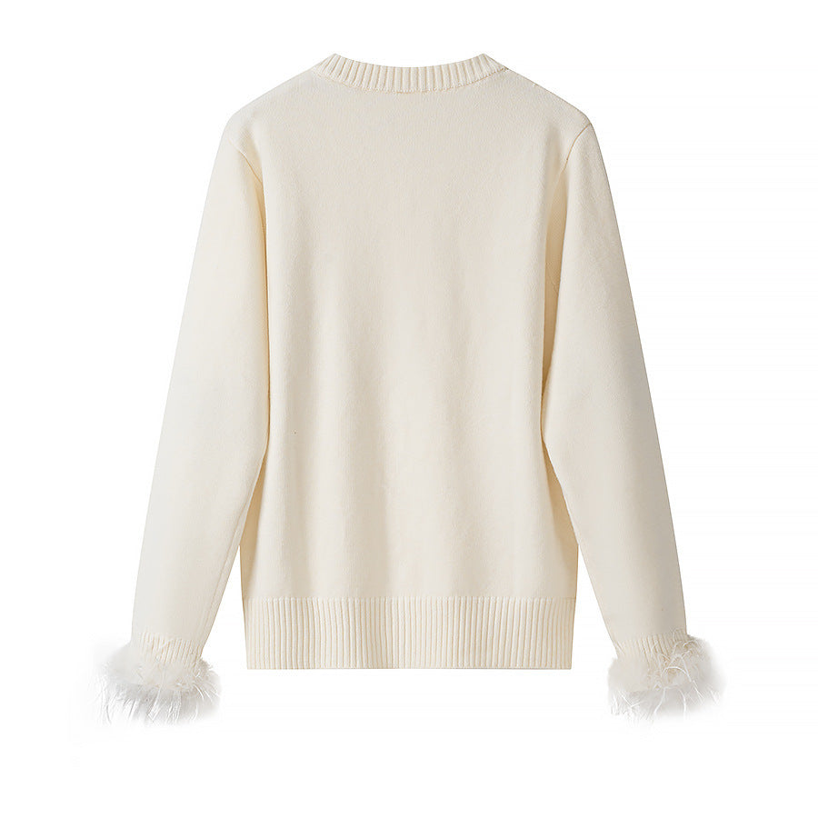 Women’s knit cardigan with pearl buttons and feather-trimmed sleeve cuffs Chichicherry