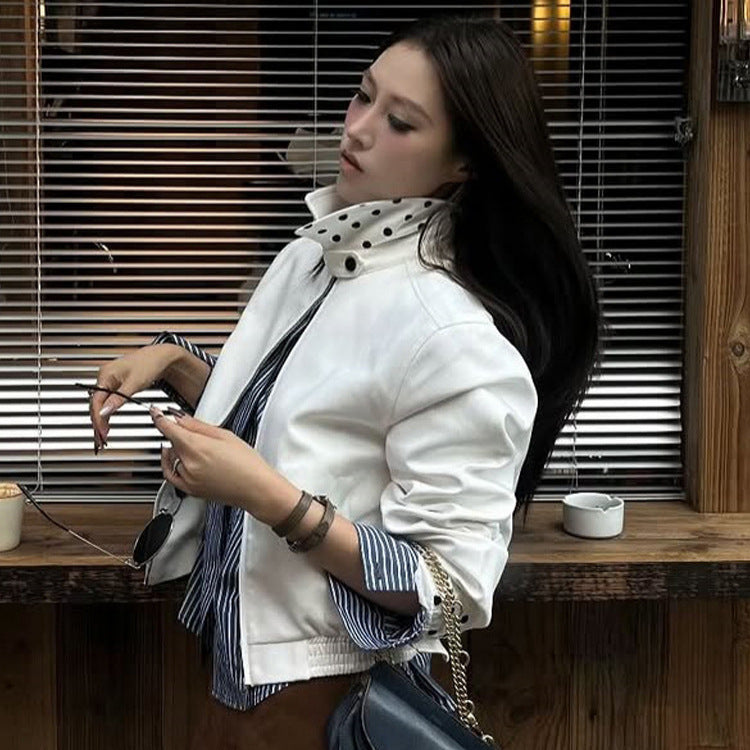 Women’s short-cut blouson jacket with stand-up collar, concealed zipper and contrasting polka dot patterned lining Chichicherry