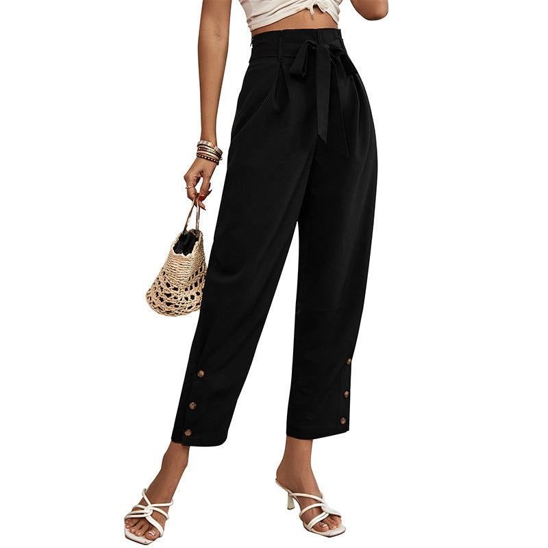 Ladies high-waisted paperbag trousers with tie belt, tapered leg and decorative button placket Chichicherry