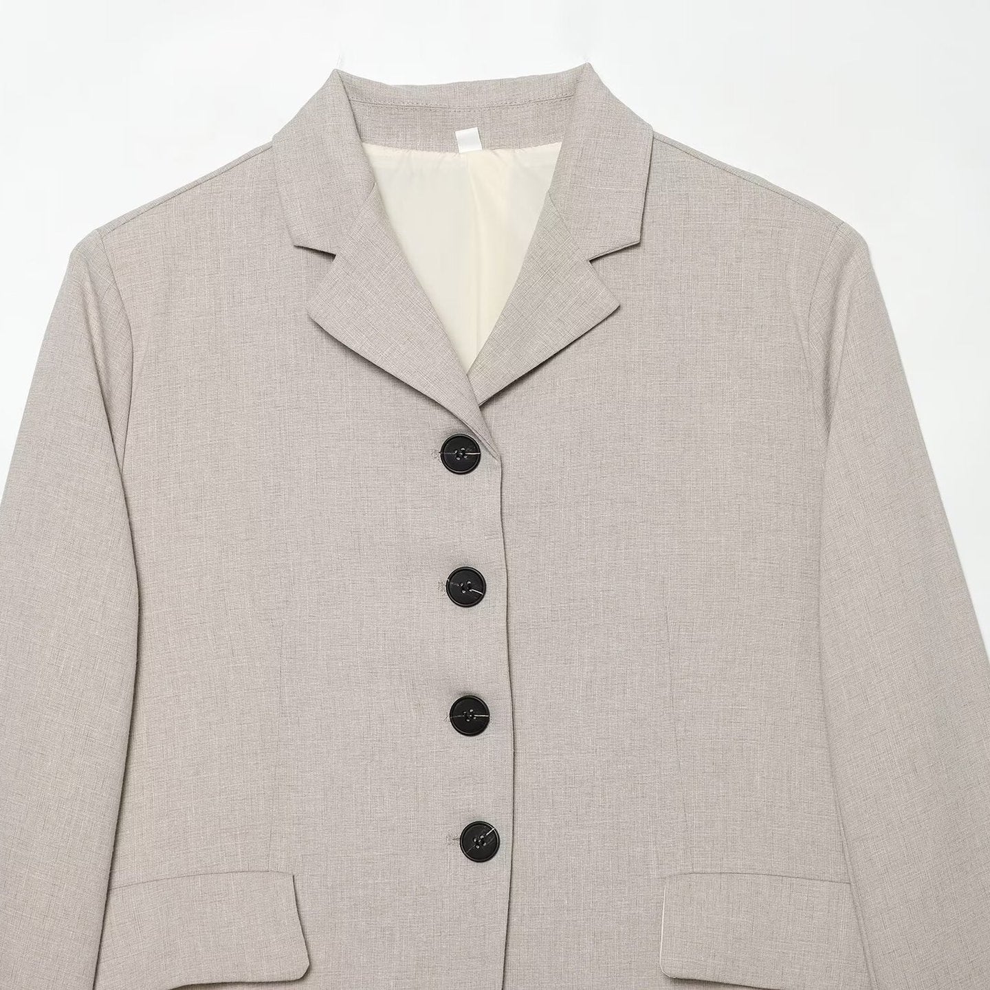 Women's short blazer with minimalist lines, rounded hem, and flap pockets Chichicherry