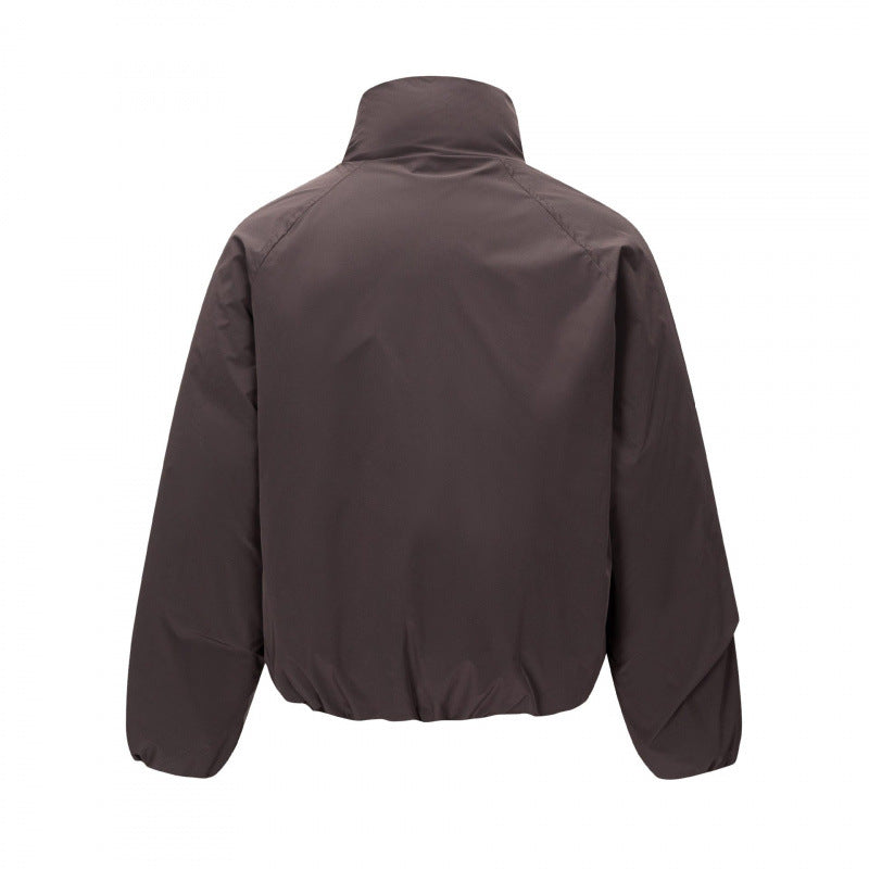 Unisex Short cut lightweight windbreaker in boxy cut with high stand-up collar and elastic hem Chichicherry