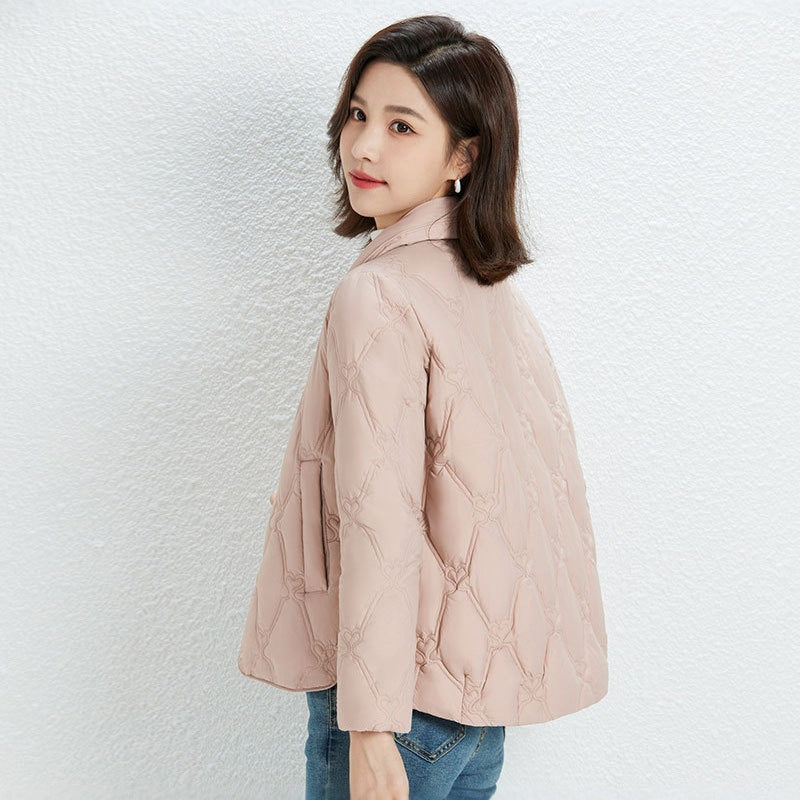 Women Short Cut Quilted Jacket with Decorative Stitching and Rounded Hem Chichicherry