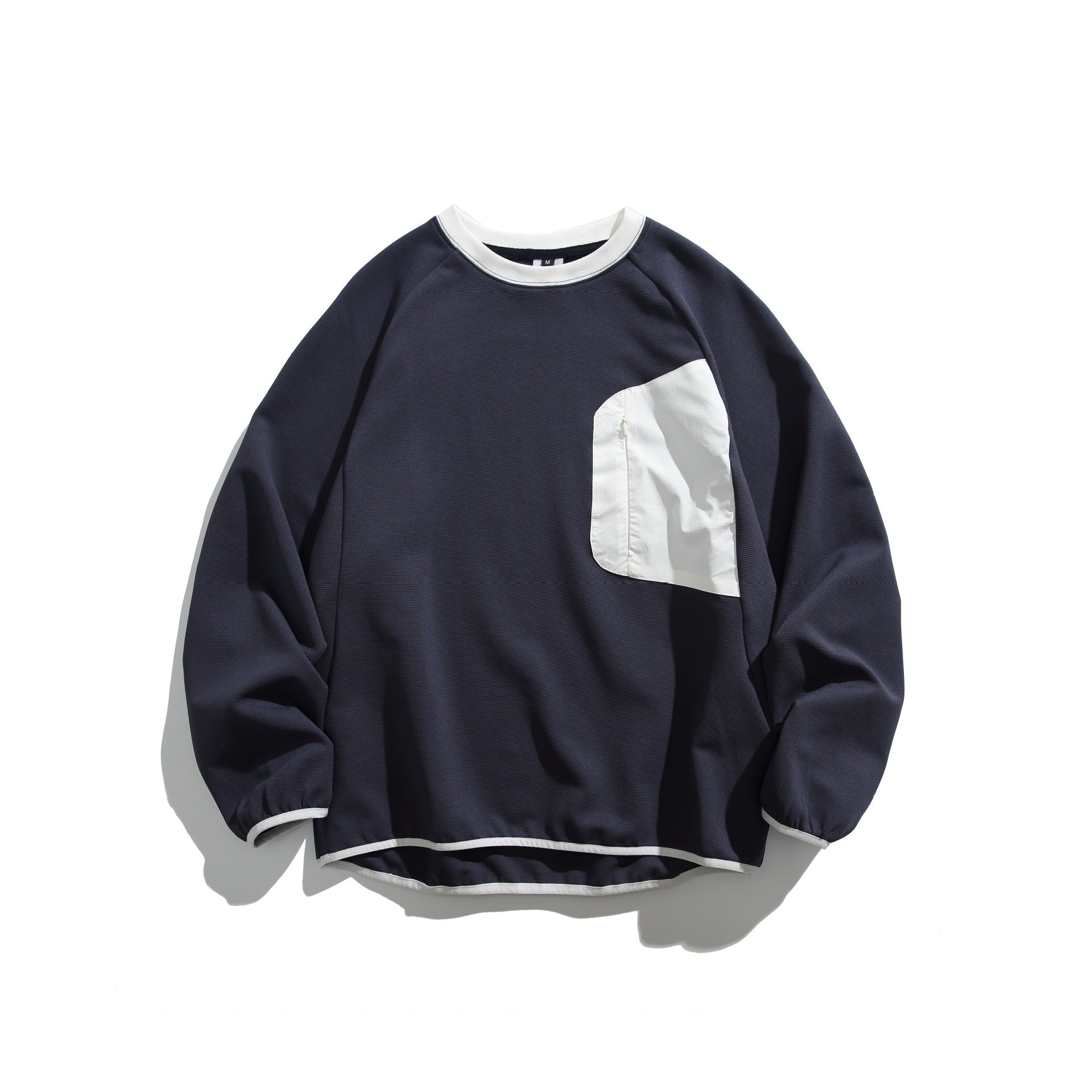Unisex Boxy Sweatshirt with technical ribbed structure, applied zippered chest pocket and ribbed hem Chichicherry