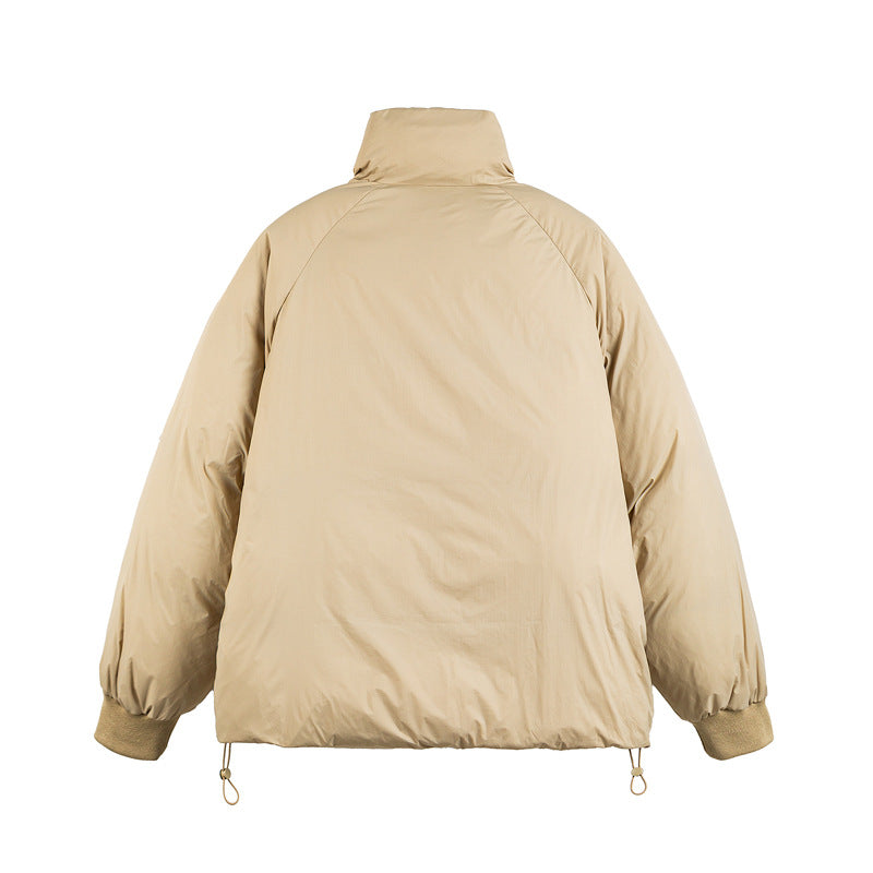 Unisex Boxy-padded short jacket with high stand-up collar, raglan sleeves and drawstring hem Chichicherry