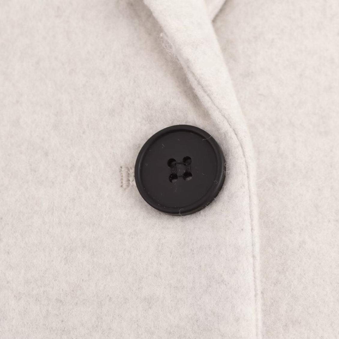 Ladies Purist longline coat with lapel collar, single button closure and soft felt finish Chichicherry