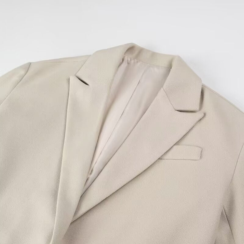 Women’s long coat with long fringe hem, boxy oversized silhouette, and lapel collar Chichicherry