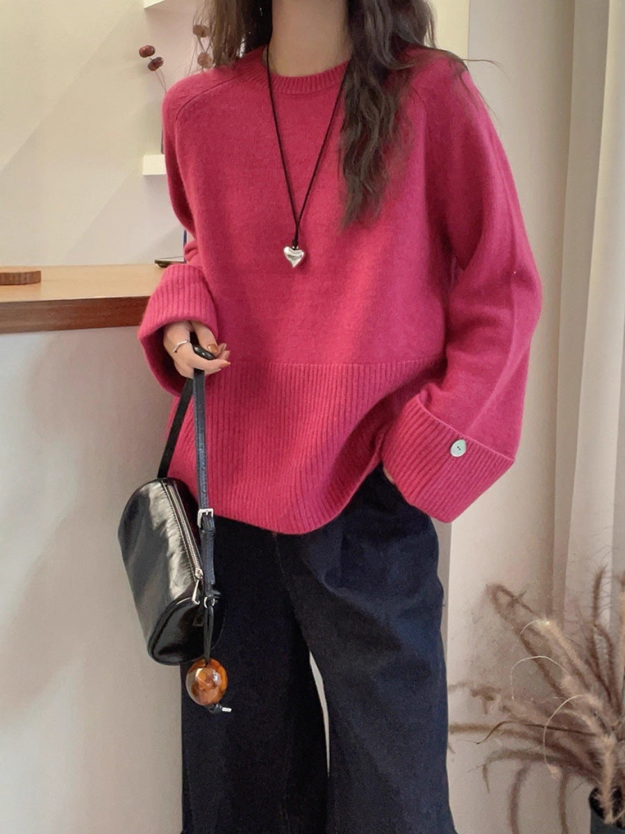 Women's oversized fine knit sweater with wide ribbed cuffs, extra wide sleeve endings, and decorative button Chichicherry
