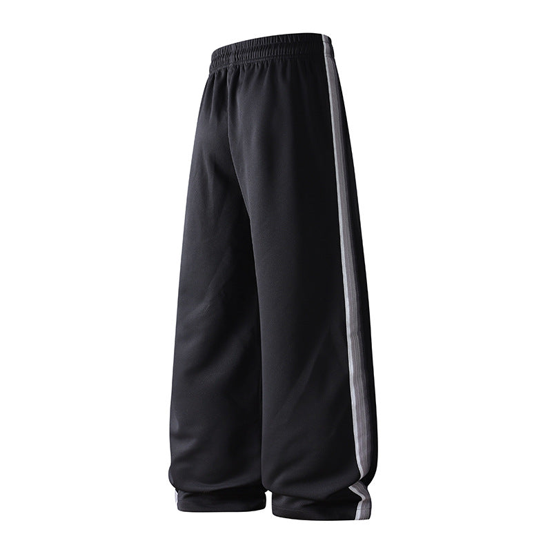 Men's loose baggy training pants with drawstring waistband, elastic comfort waistband, and side stripe detail Chichicherry