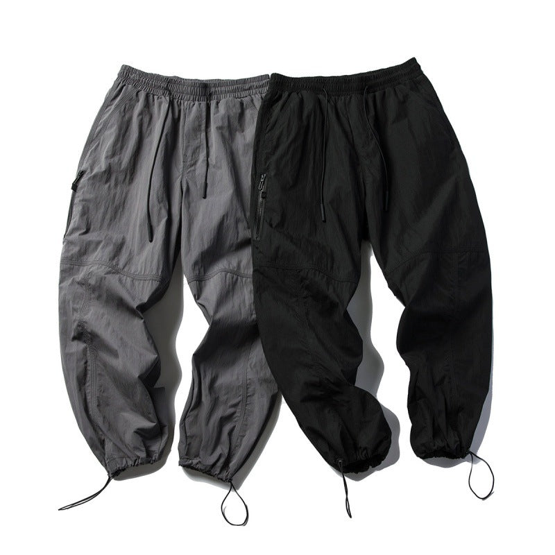 Unisex Technical Cargo Pants in Baggy Cut with Drawstring Waist and Adjustable Leg Closures Chichicherry