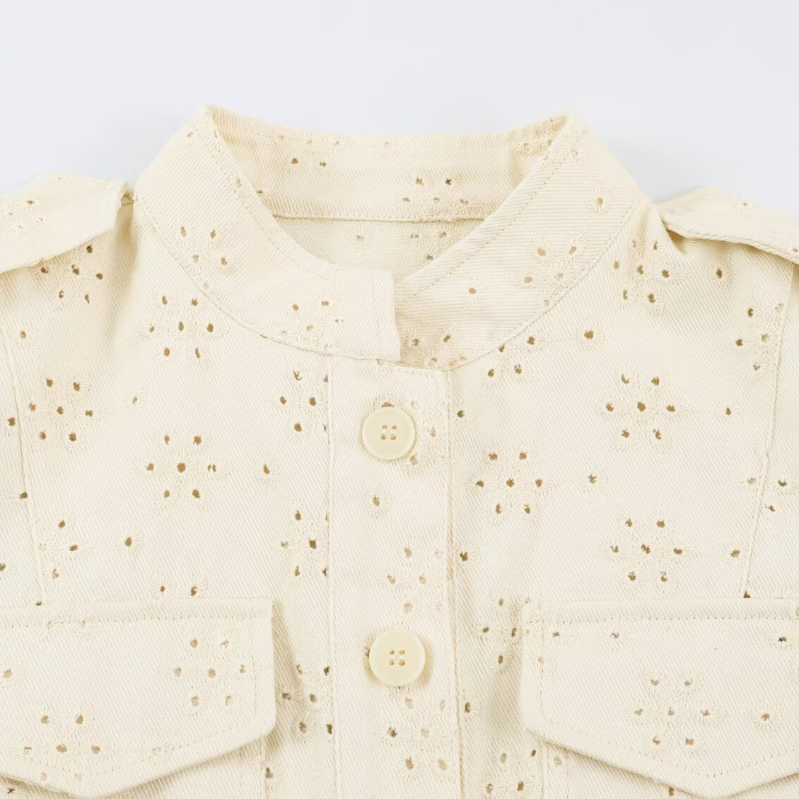 Ladies short jacket made of broderie anglaise with stand-up collar and patch pockets Chichicherry