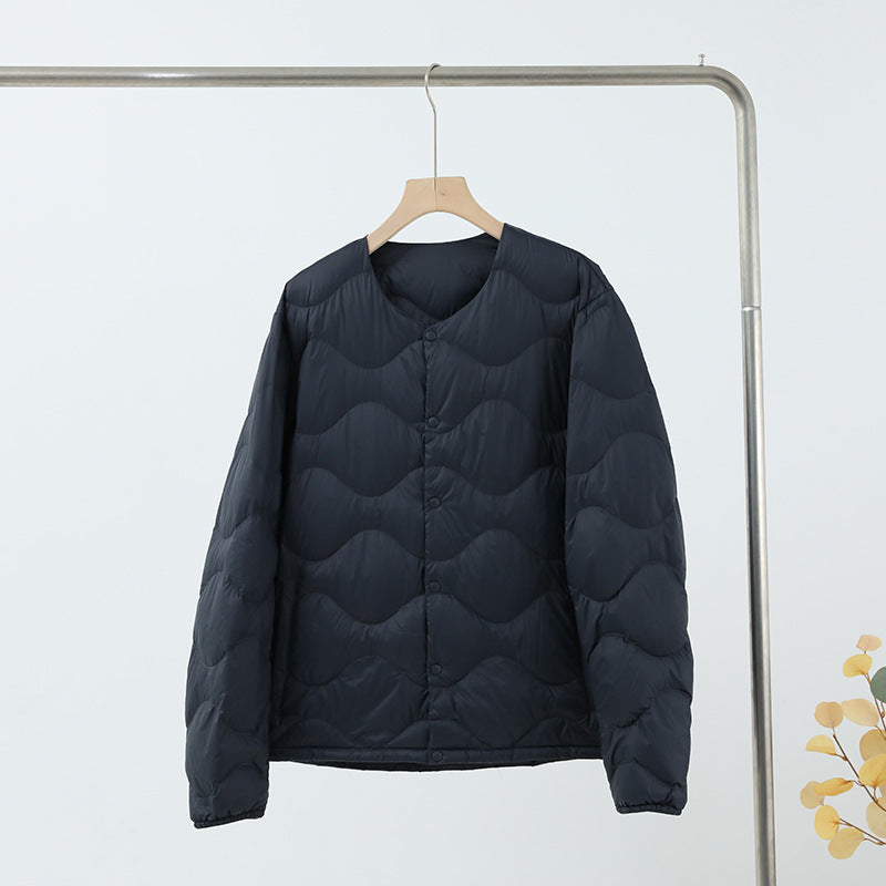 Women’s sleeveless thermal quilted vest with wave-shaped quilting and snap button closure Chichicherry